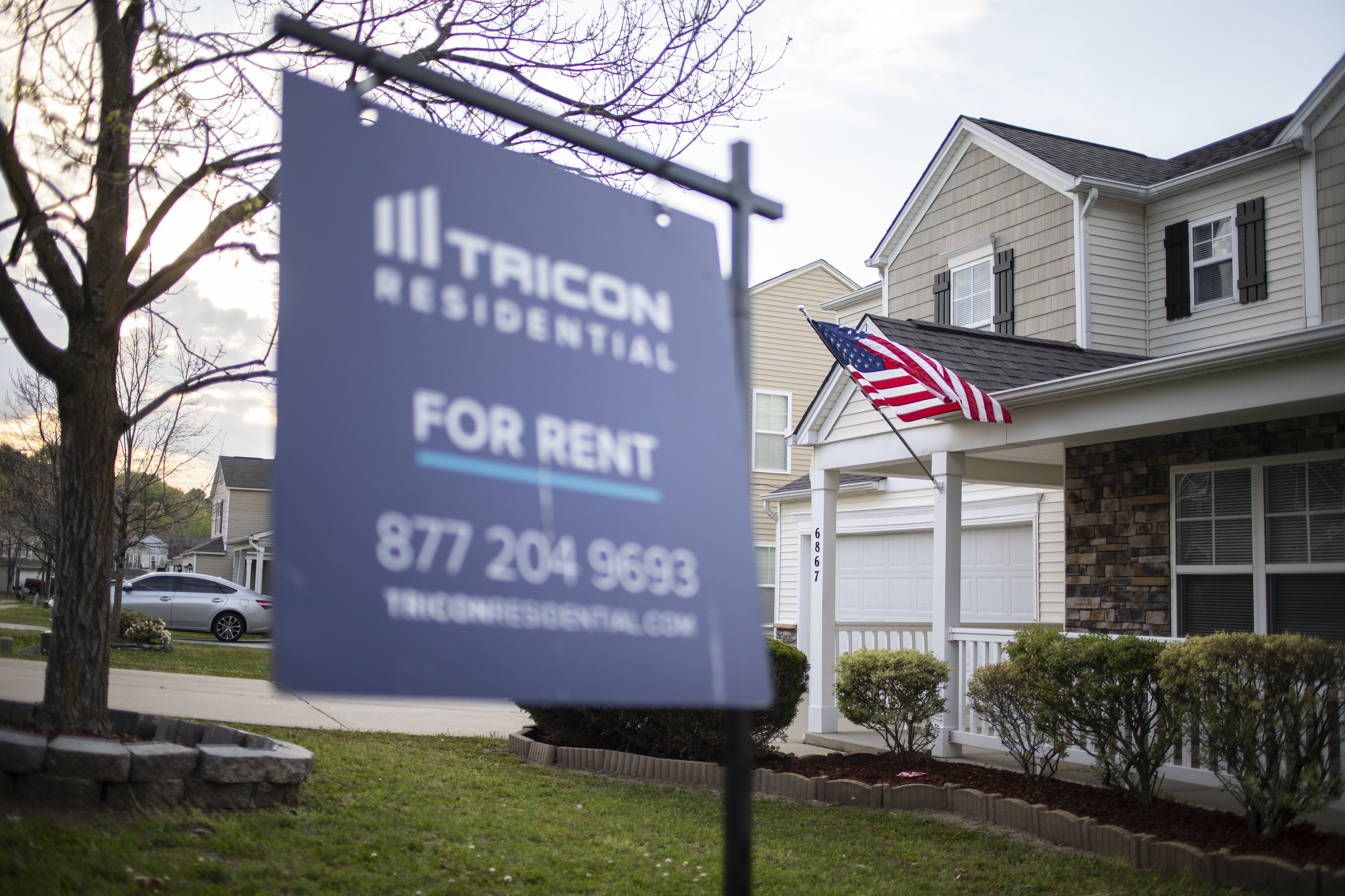 A "For Rent" sign sits in the yard of a Raleigh home owned by Tricon Residential in early 2022. // Julia Wall
